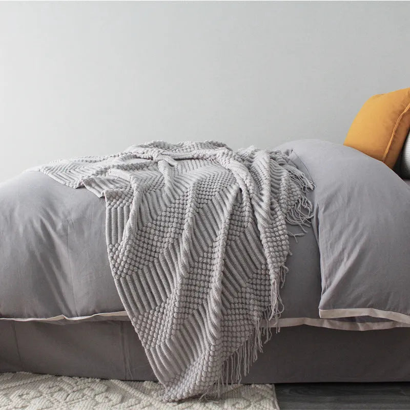 Small grey polyester nap blanket folded to show its 127x170cm size