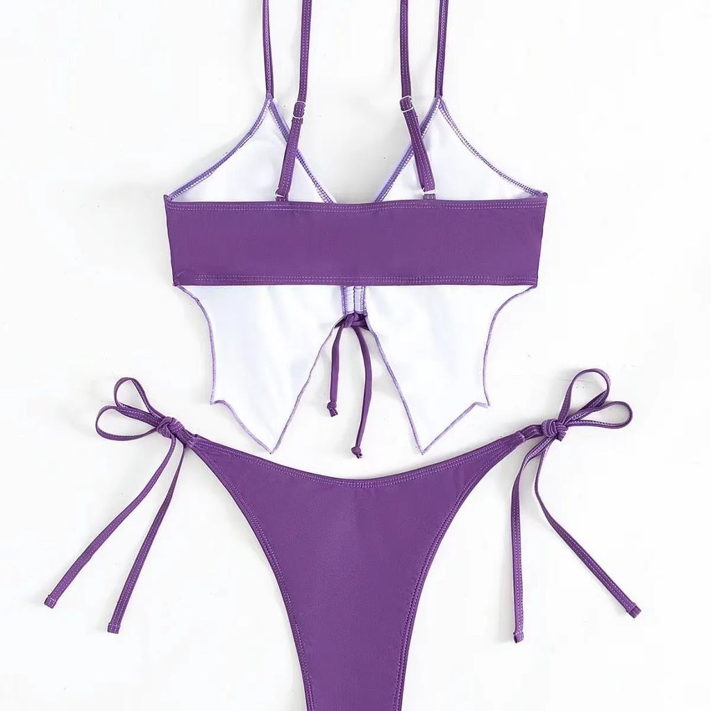 Purple women's bikini suit with bow ins style detail, showing sleeveless top and high-leg briefs.