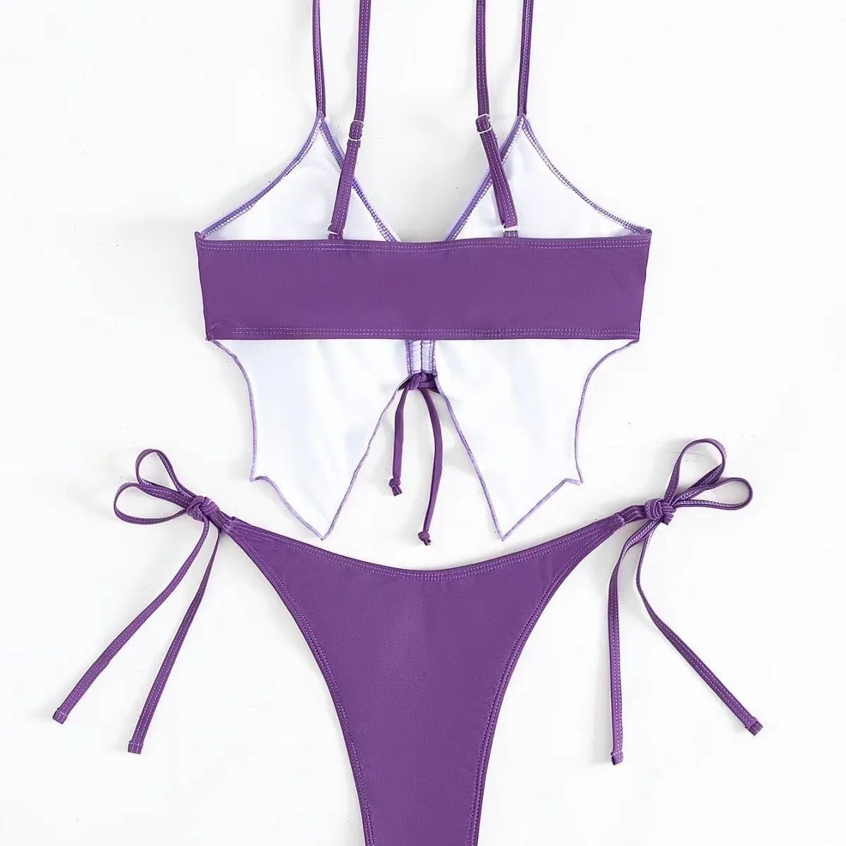 Purple women's bikini suit with bow ins style detail, showing sleeveless top and high-leg briefs.