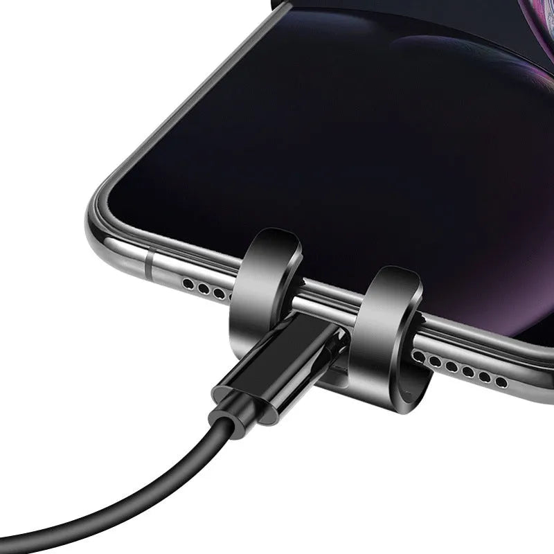 Black S4 gravity mirror car phone bracket mounted on a car air vent, holding a smartphone.
