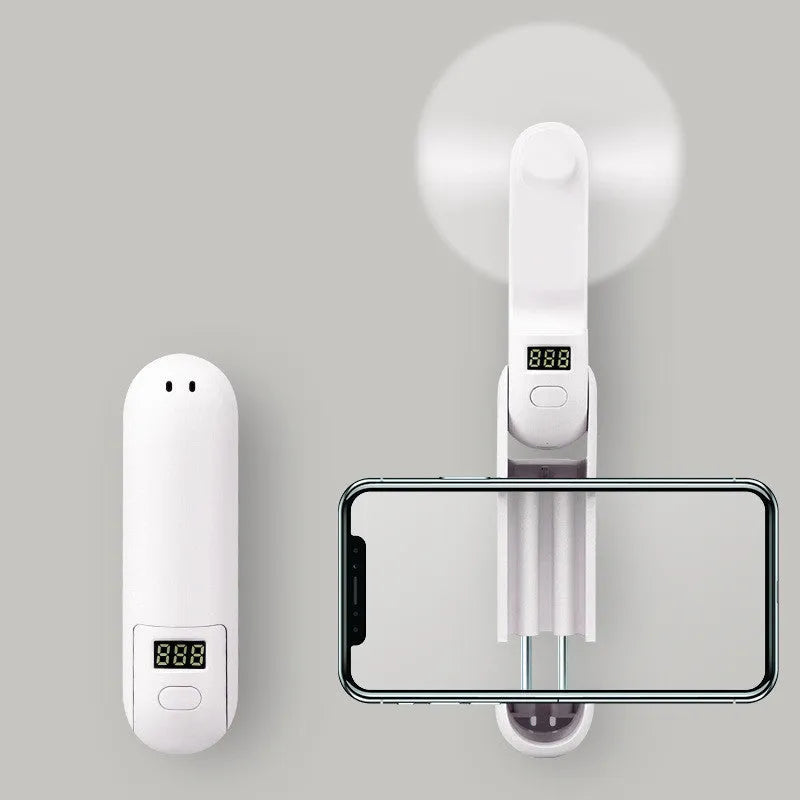 Green folding mini USB fan with plastic blades in open position
