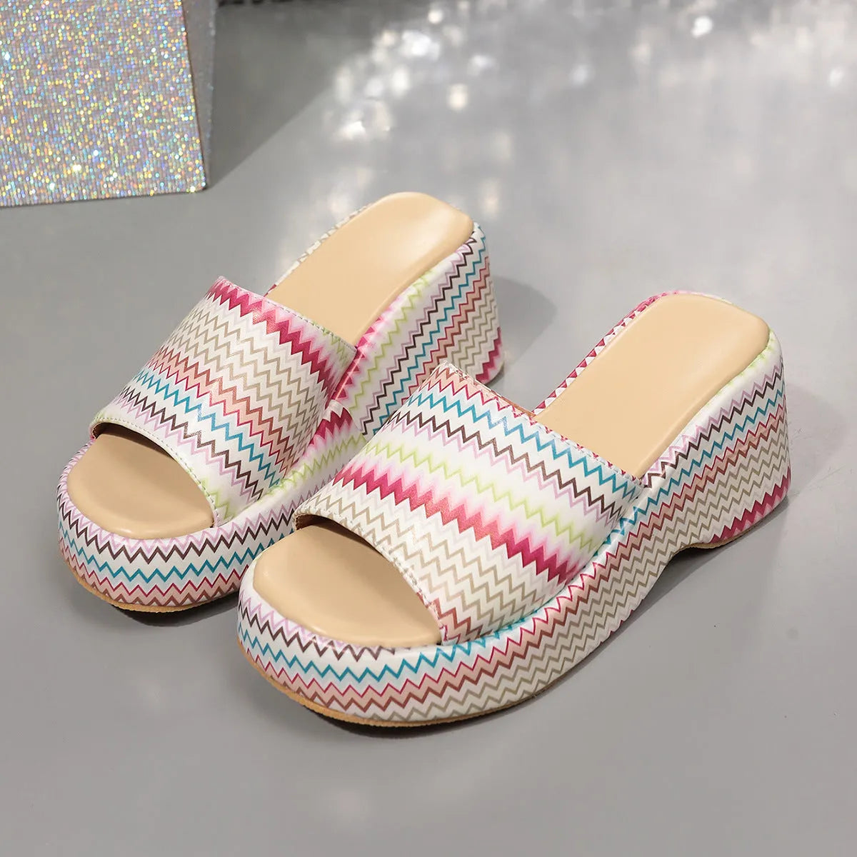 Colourful wave print women's wedge sandals with a fish mouth toe and thick rubber sole.