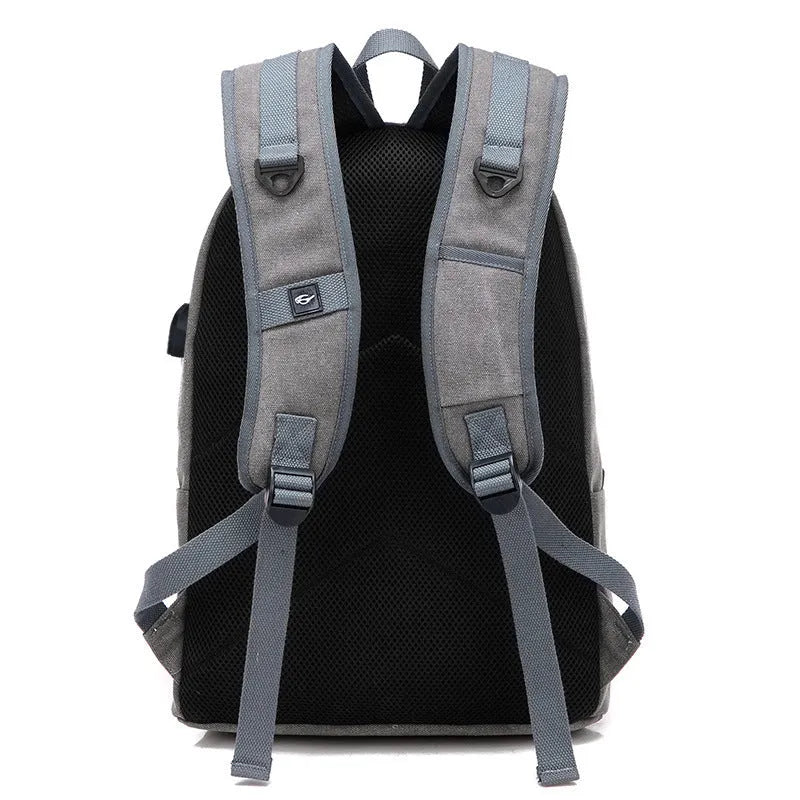 Canvas backpack with USB charging port in grey colour showing compartments