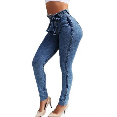 Women's fringed jeans in Cowboy denim, showing fringe detail on leg, available in dark blue, grey, and light blue.