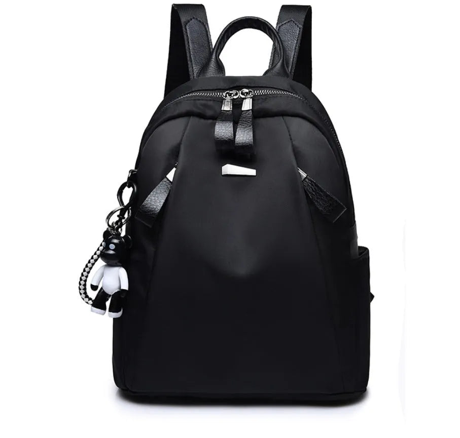 Medium square fashion rucksack in Oxford cloth, shown in red, with internal phone and ID pockets.