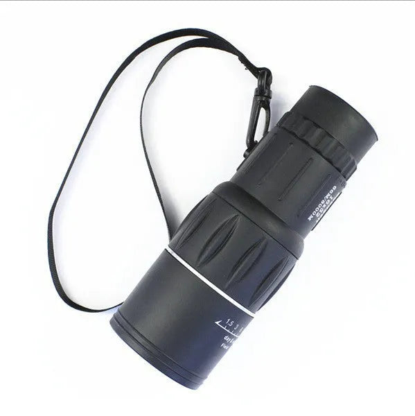 16x52 black monocular with BAK4 roof prism and green film coating on a white background