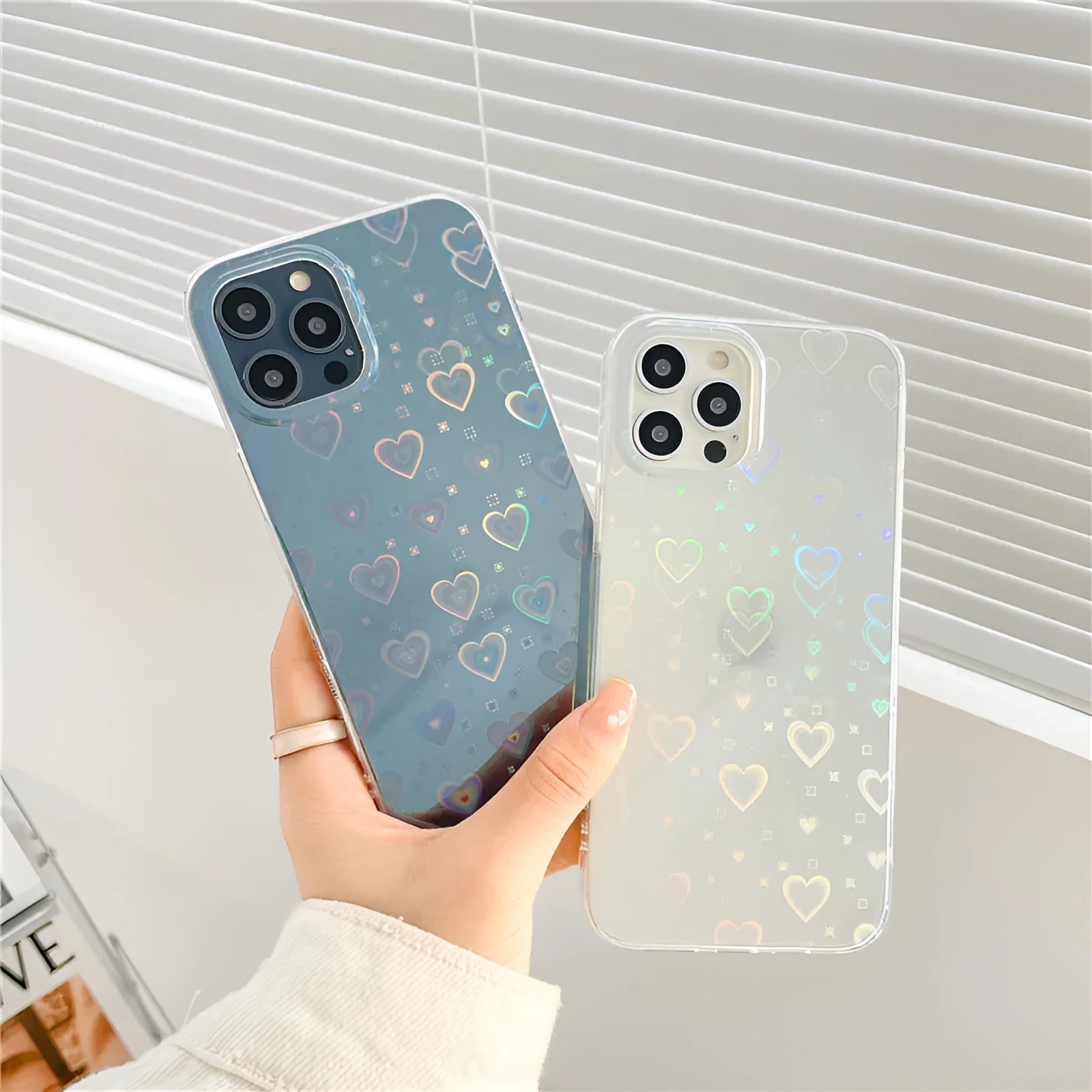 Transparent silicone iPhone case with laser love pattern design showing butterfly and clear options
