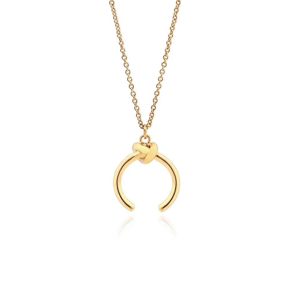 Vintage-style copper pendant necklace with geometric shape on cross chain in gold or silver finish