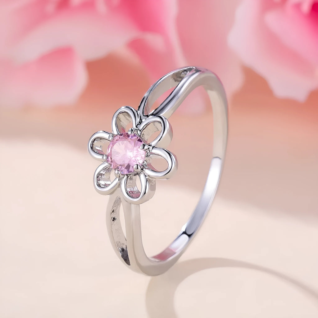 Lady's copper flower hollowed ring with electroplated finish in white gold powder colour on white background