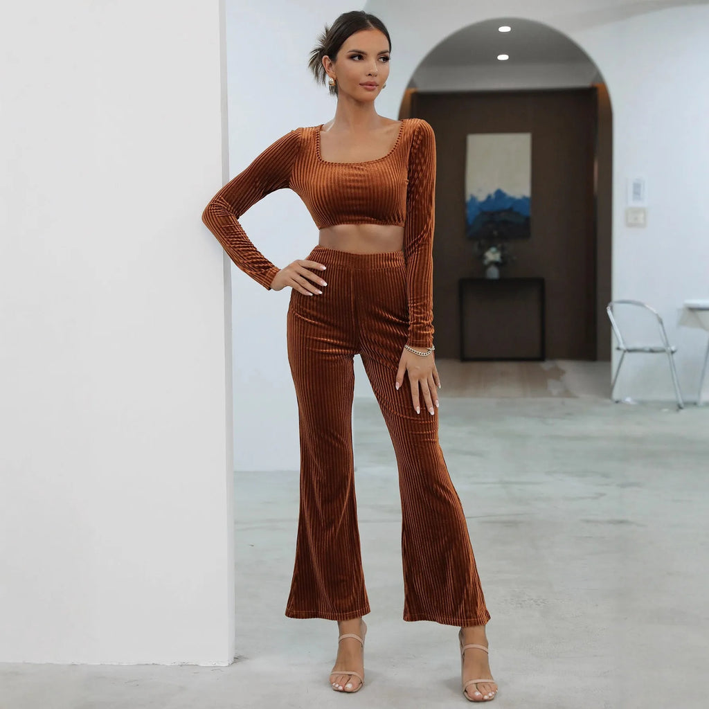 Caramel coloured long sleeve sweater and trousers casual set on a hanger.