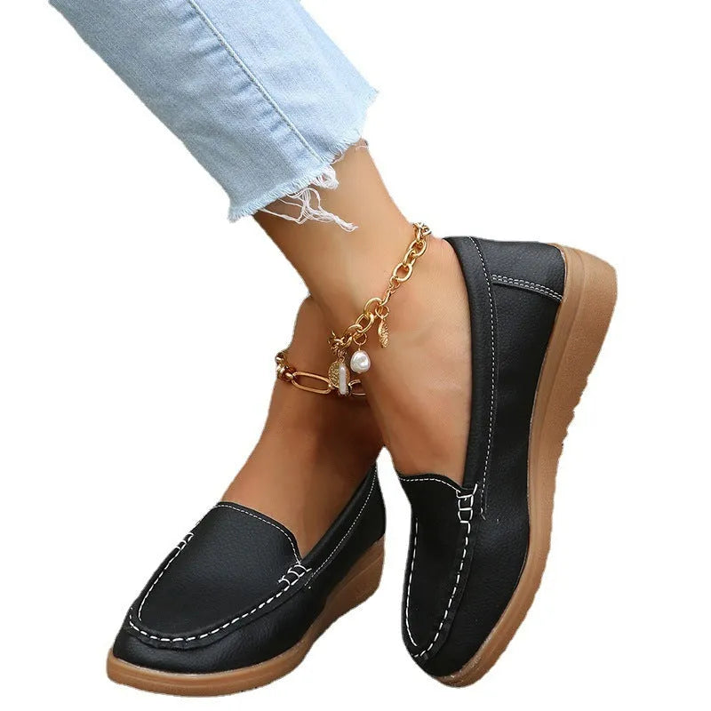 Women's flat laofer shoes in PU leather with car suture detail and a round toe, shown in multiple colours.