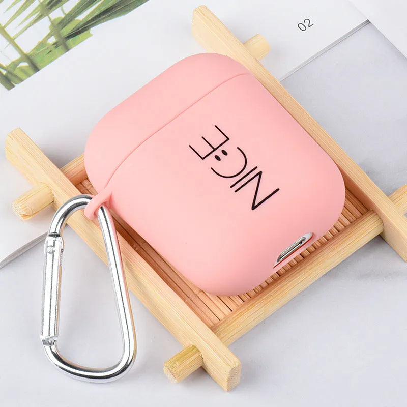 Black and pink AirPods case covers with smiley face and flower decorative motifs