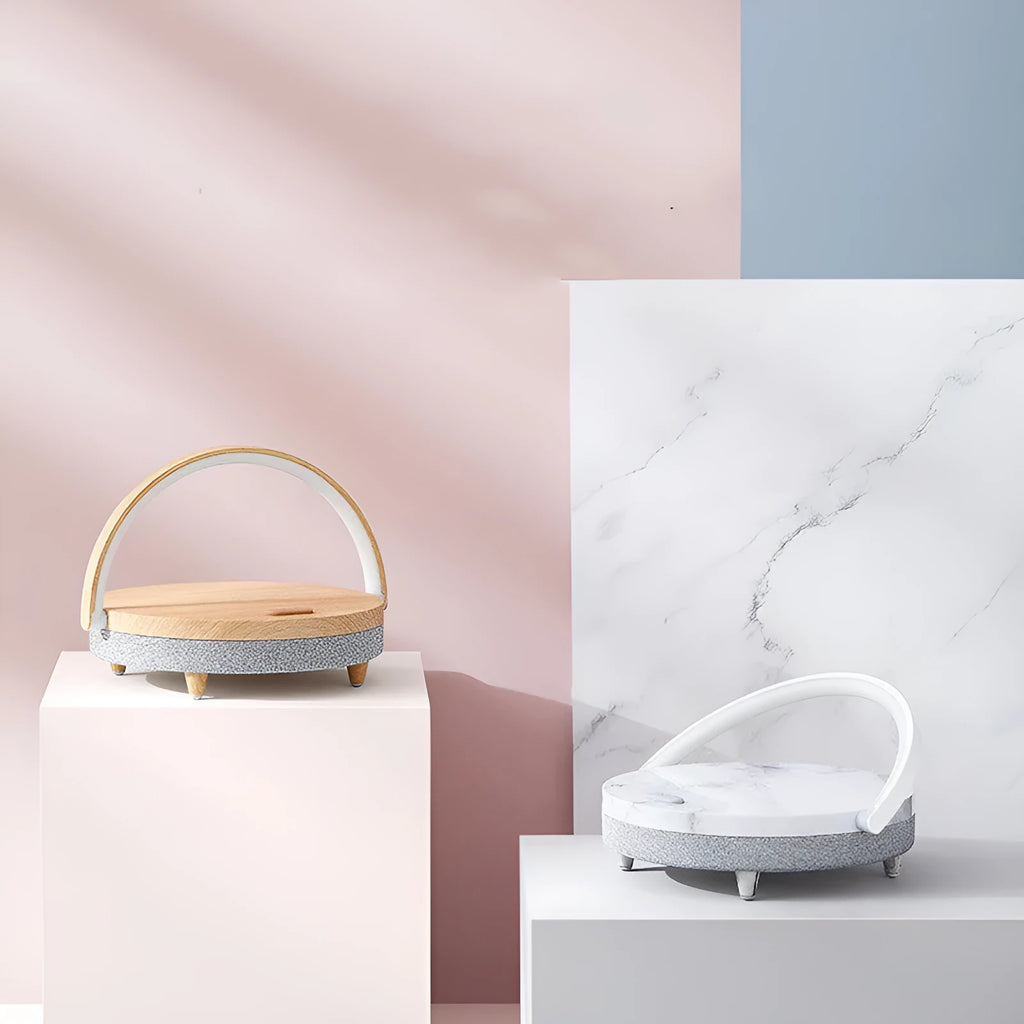 White multifunctional bedside lamp with wireless charging pad, Bluetooth speaker grille, and integrated phone holder in marble pattern finish.