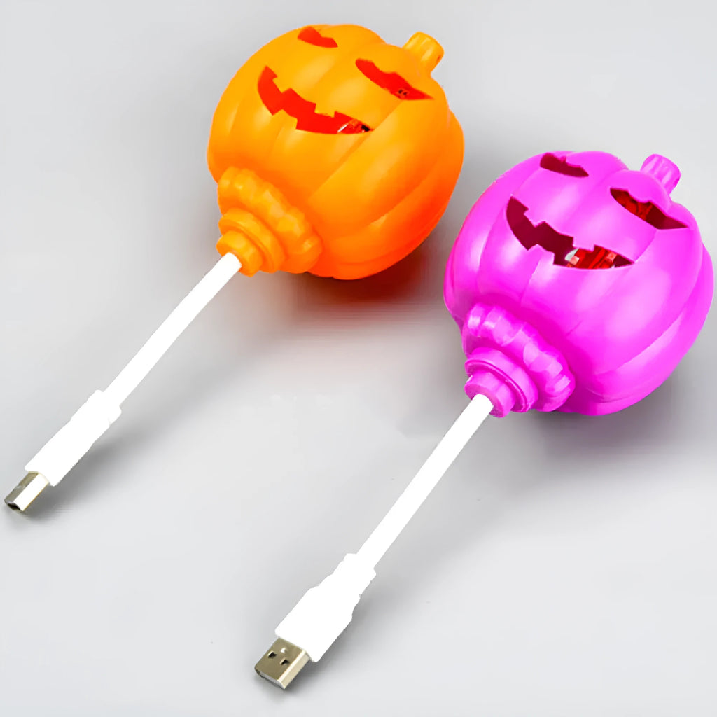 Plastic pumpkin-shaped decorative lamp with USB charging port, showing yellow or purple light option.