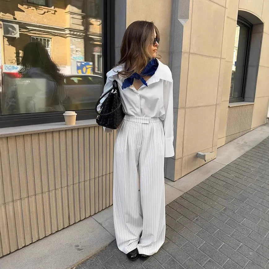 White striped wide-leg trousers with front zip fastening and loose casual cut for commuting