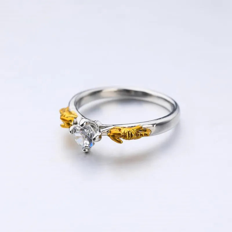 Copper crown crystal ring with black gold finish showing sizing options