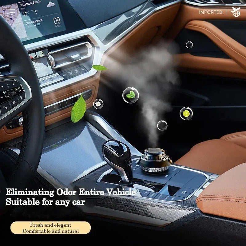 Solar-powered kinetic car air freshener with rotating black double rings on a dashboard