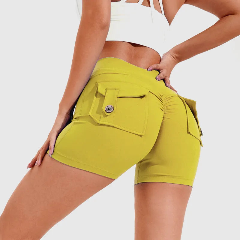 Women's high-waisted fitness shorts with pockets in quick-dry nylon fabric, shown in avocado green colour
