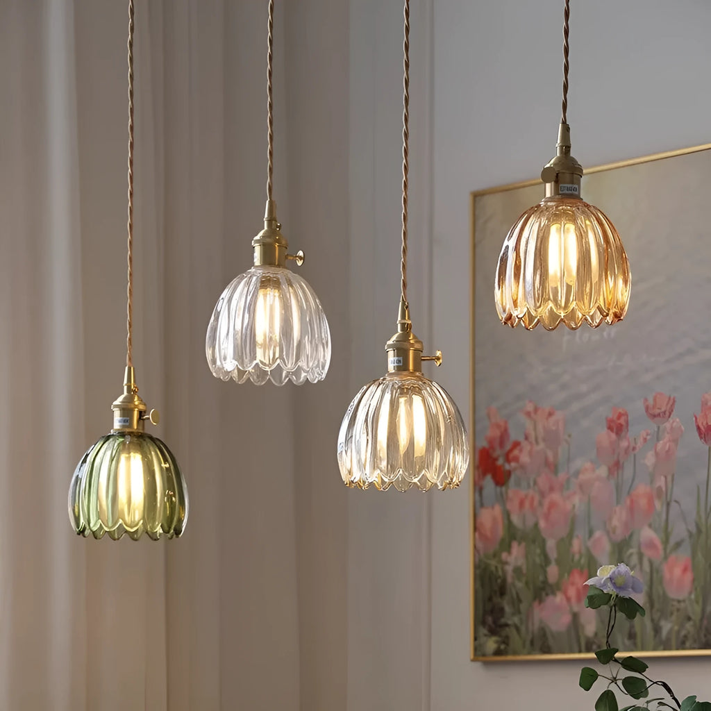 Nordic style bedside chandelier with a glass flower shade in amber, on a white background.