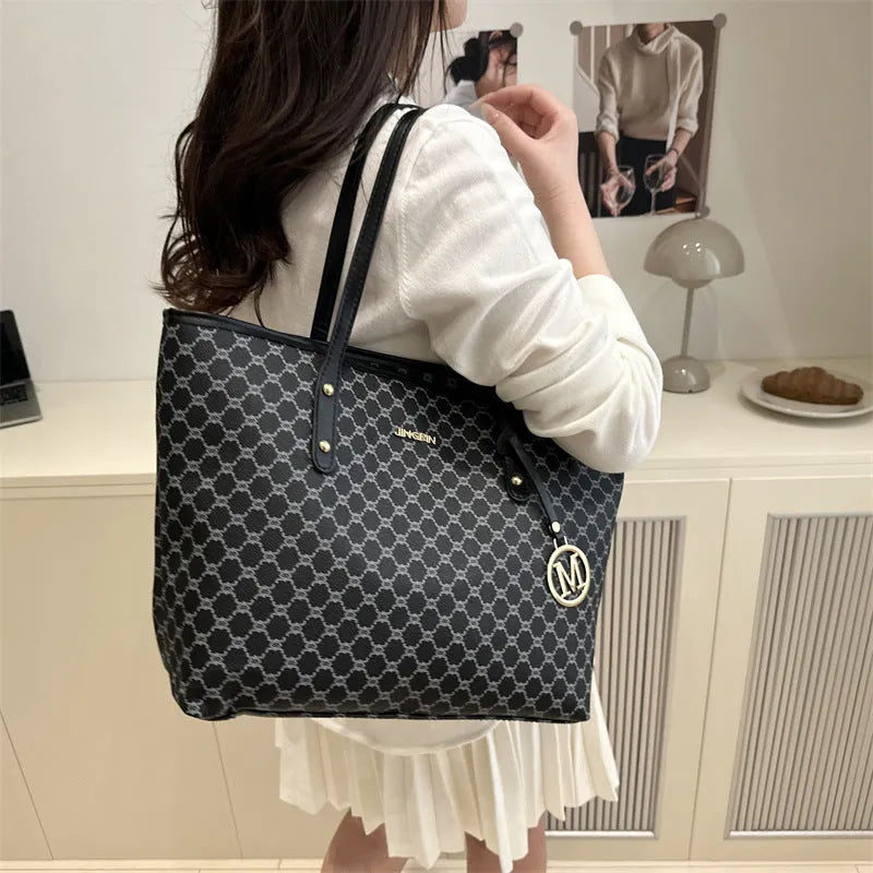 Western style black PU shoulder bag with sewing thread detailing and adjustable strap.