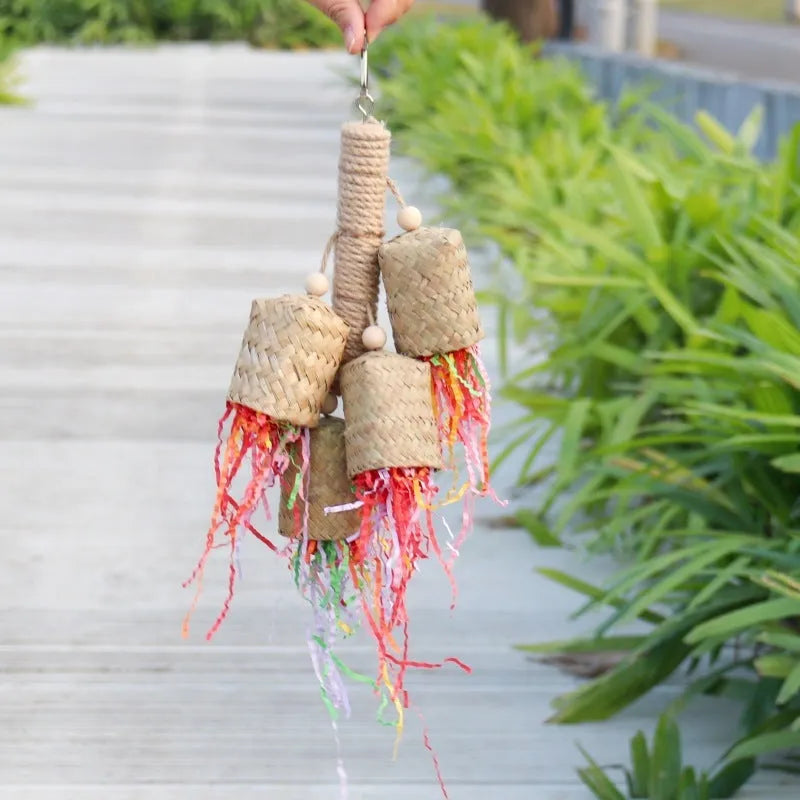 Wood and sisal parrot toy with shredded paper, measuring 15 by 35 centimetres