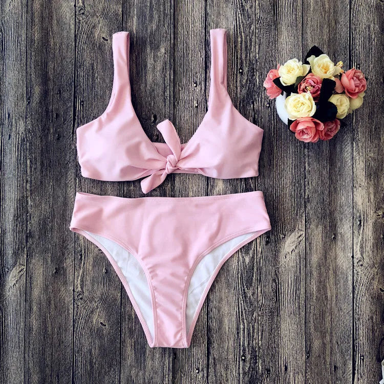 Solid colour polyester bikini swimsuit set on a white background