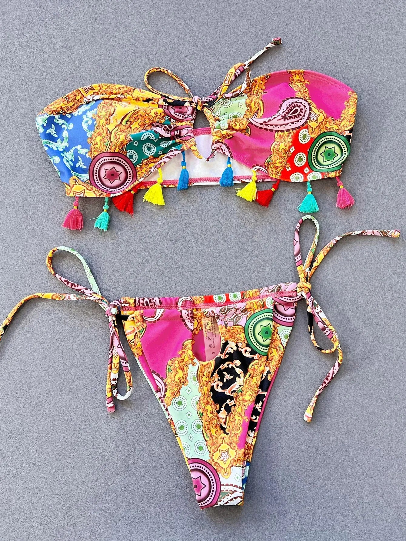 Women's separated bikini set with printed tube top and briefs on a mannequin