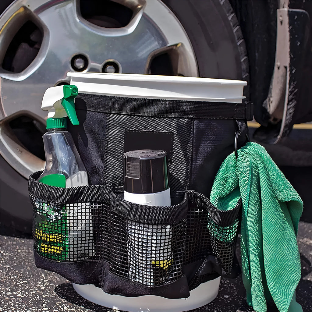 Black cylindrical polyester hanging storage bag fitted on 5 gallon barrel for tool organisation