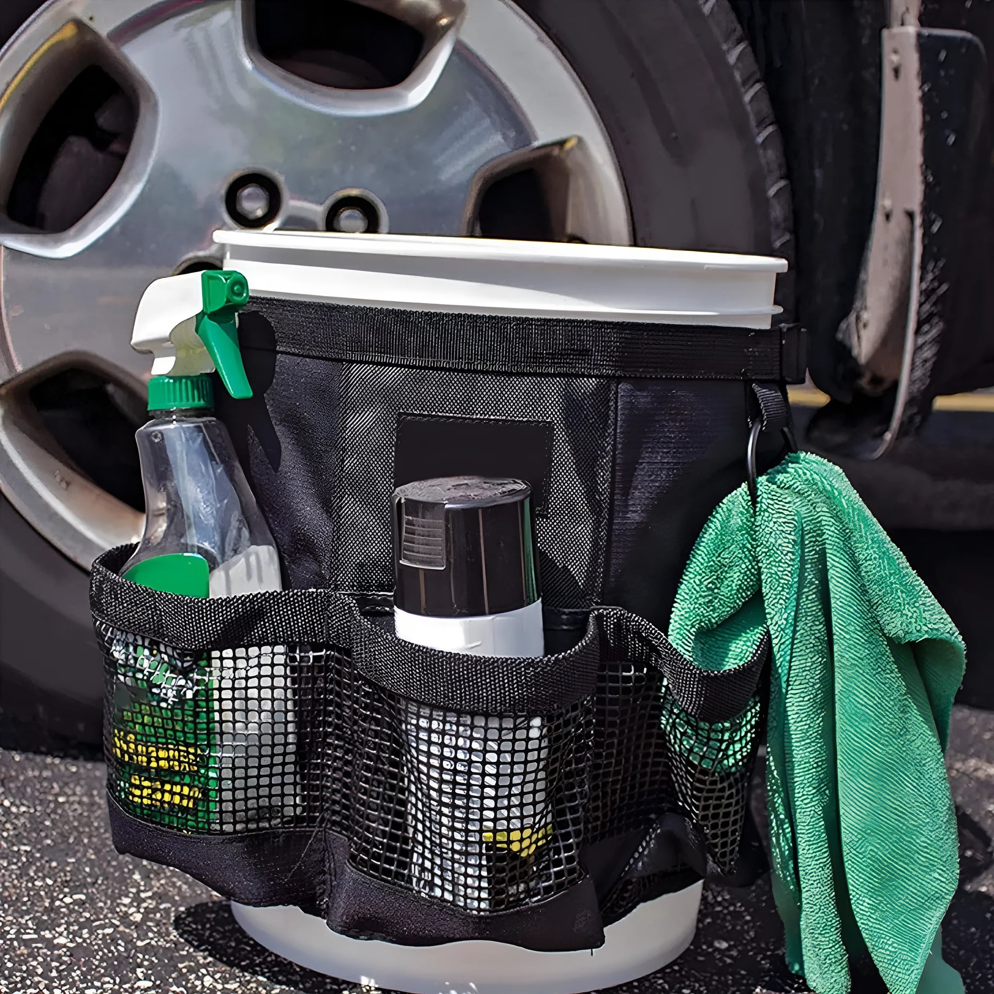 Black cylindrical polyester hanging storage bag fitted on 5 gallon barrel for tool organisation