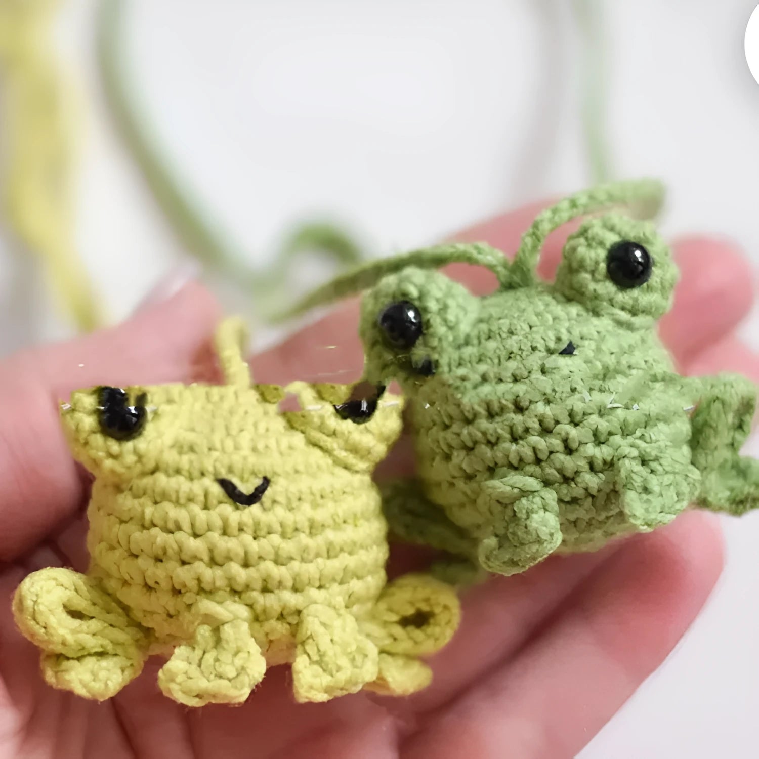 Handmade woven frog car pendant in green colour, 5cm wide by 15cm long