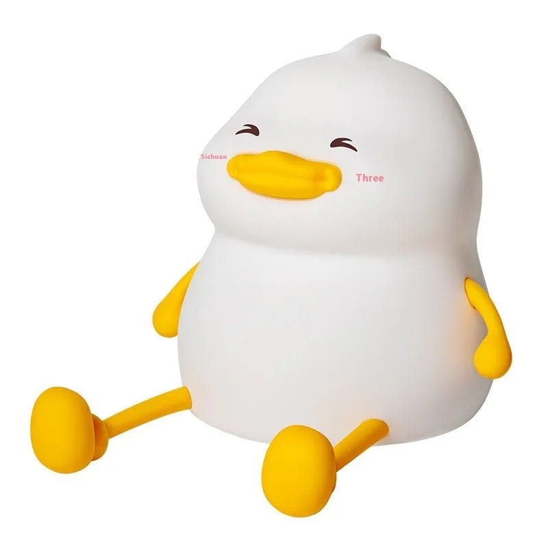 Chubby silicone night lamp with phone holder function showing compact design and adjustable LED lighting