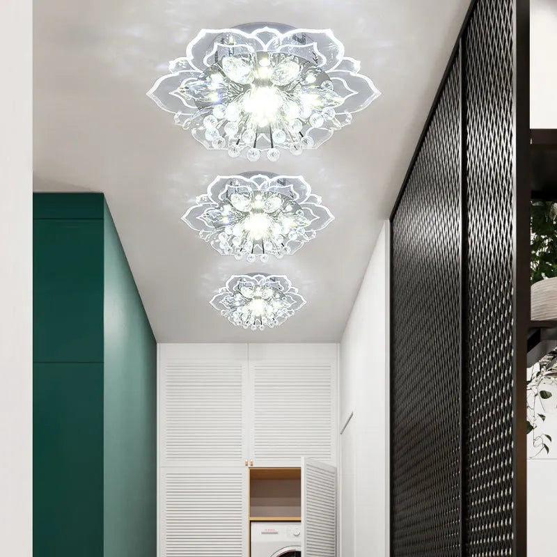 Modern crystal ceiling lamp with flower-shaped acrylic and crystal shade showing LED lighting