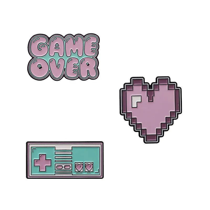 Stereo game console alloy pin badge in three colour options CC1122 CC1123 CC1124 on white background