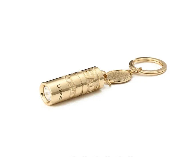 Gold zinc alloy waterproof LED flashlight keychain showing 7cm compact design