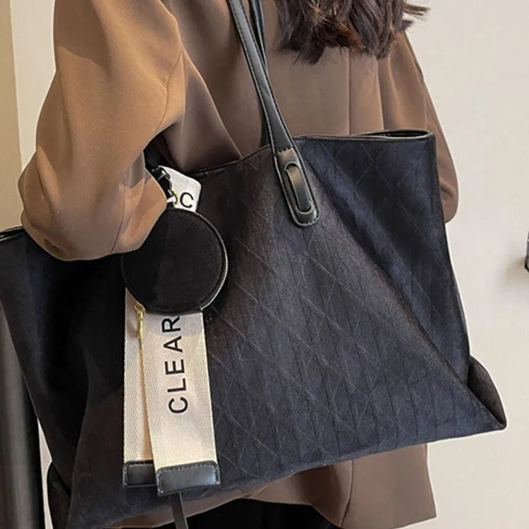 Large soft polyester shoulder bag in horizontal square shape with outer pocket, shown in light khaki colour.