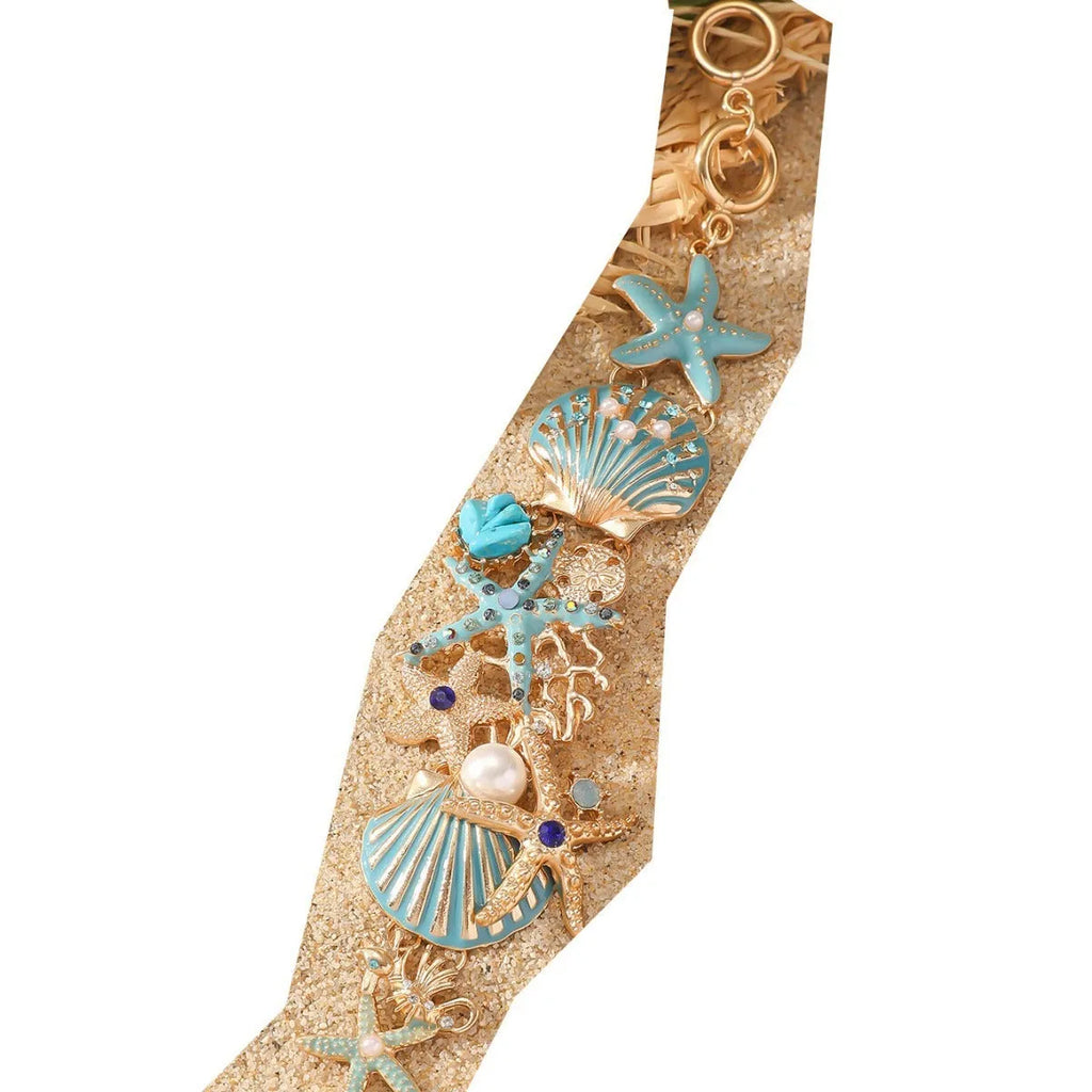 Women's alloy bracelet with rhinestone boat anchor charm and starfish detail in turquoise, red, or blue.