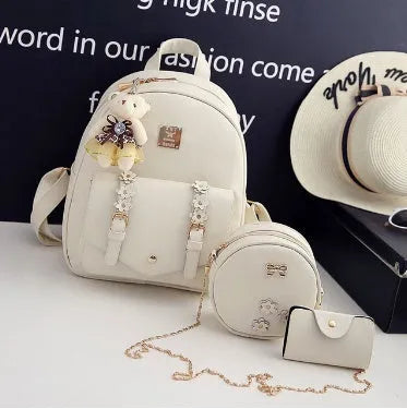Women's three-piece PU leather backpack set with matching shoulder bag and card wallet in floral design