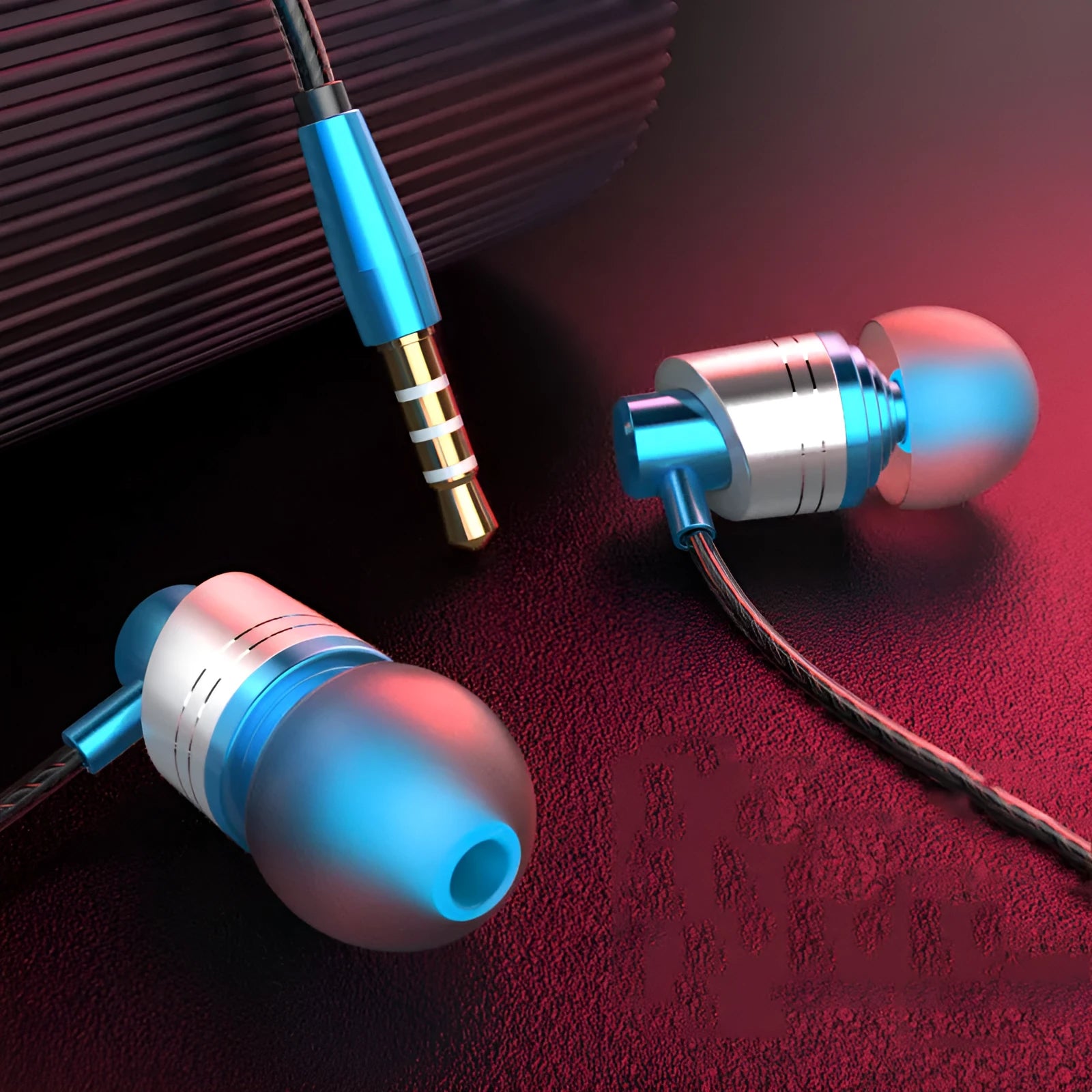 Black wired in-ear headphones with microphone, 3.5mm plug and silicone eartips on a white background