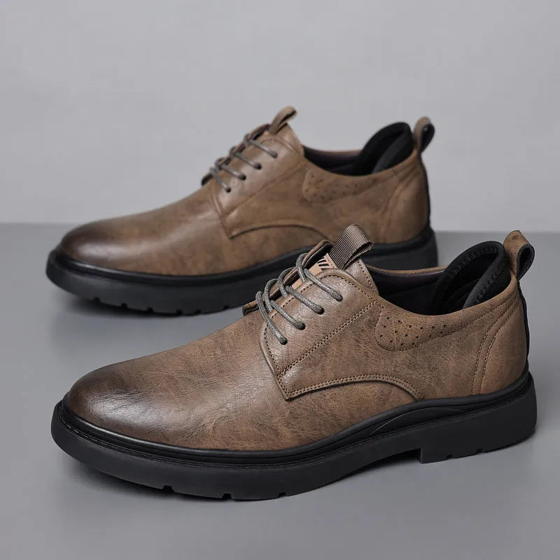 Men's black and brown leather casual sneakers with rubber sole and sewing line detailing