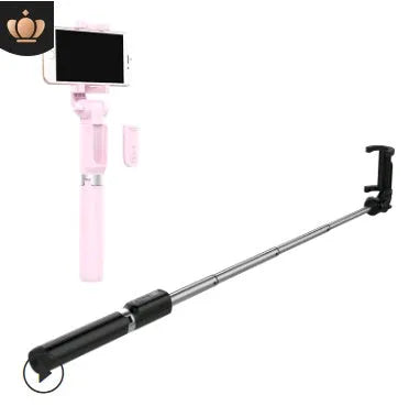 Black Bluetooth selfie stick tripod with remote control extended, holding a smartphone