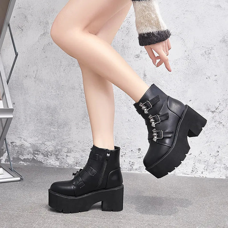 Black women's punk ankle boots with bat buckle decoration and side zip closure
