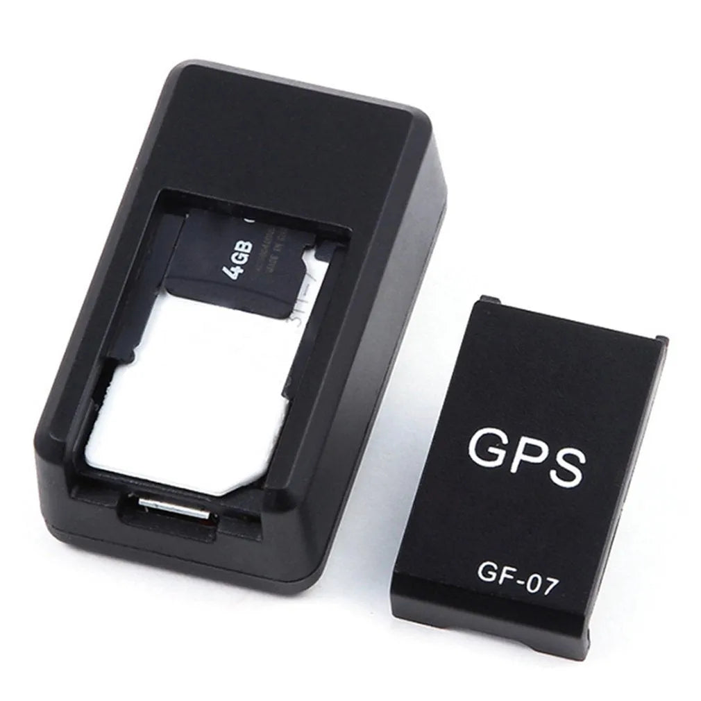Small black magnetic GPS car tracker device for real-time vehicle and asset tracking.