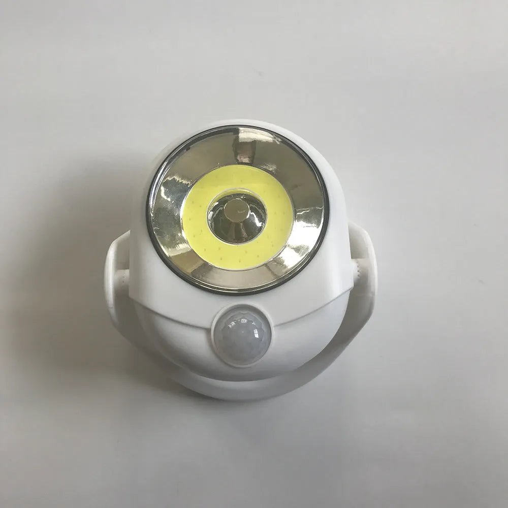 White Atomic Angel induction night light on flat surface with dimensions shown
