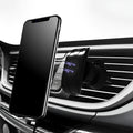 Black car air vent phone holder with magnetic smartphone attachment mounted on vehicle ventilation outlet
