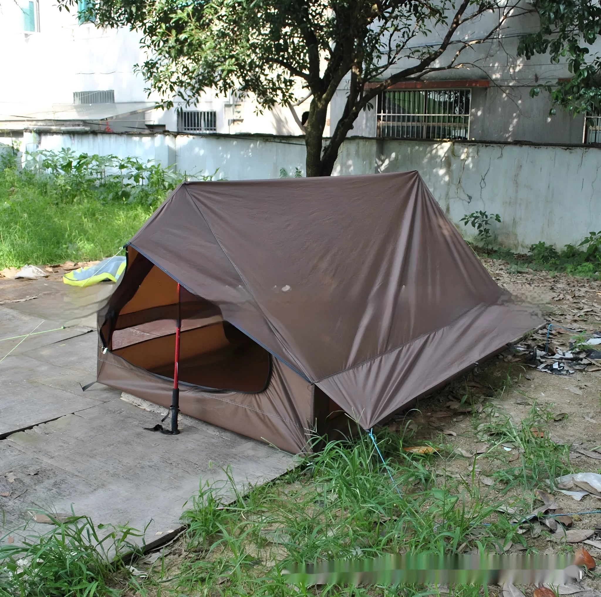 Brown A-line trekking tent pitched using hiking poles with dimensions 210x150x110cm