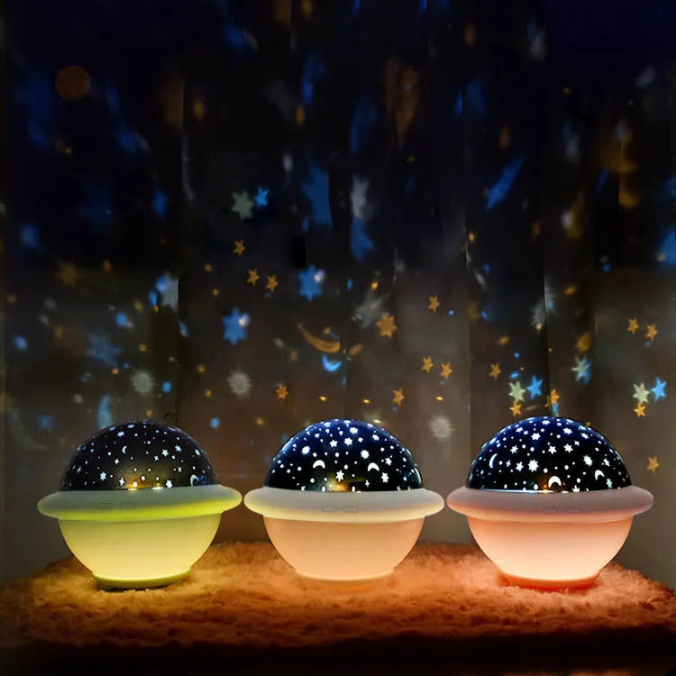 Green UFO-shaped LED star projector light showing rotating star projection on wall