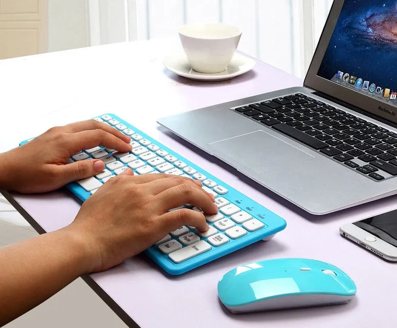 96-key wireless keyboard and mouse set in choice of four colours on a desk.