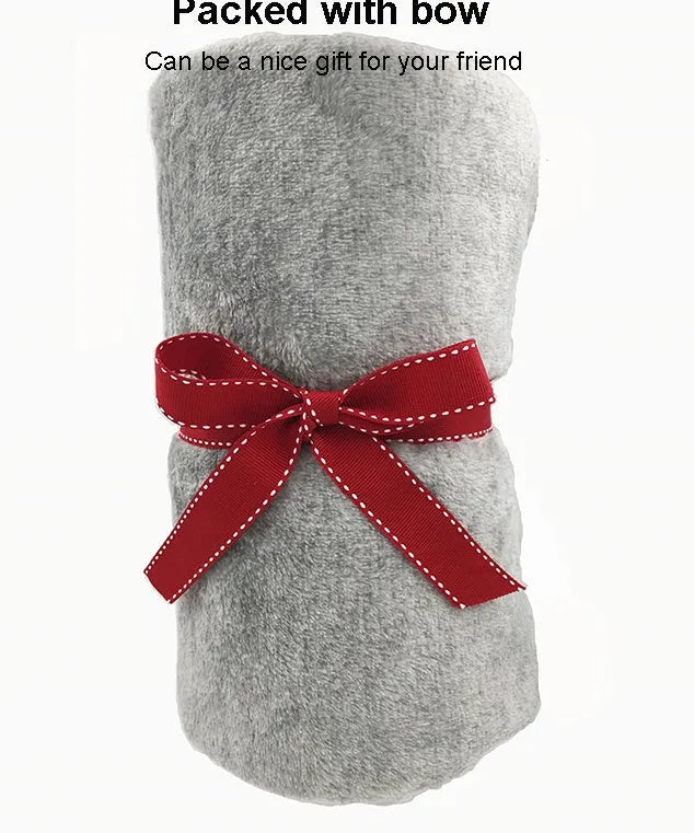 Grey flannel dog blanket 70 by 100 centimetres on a soft surface