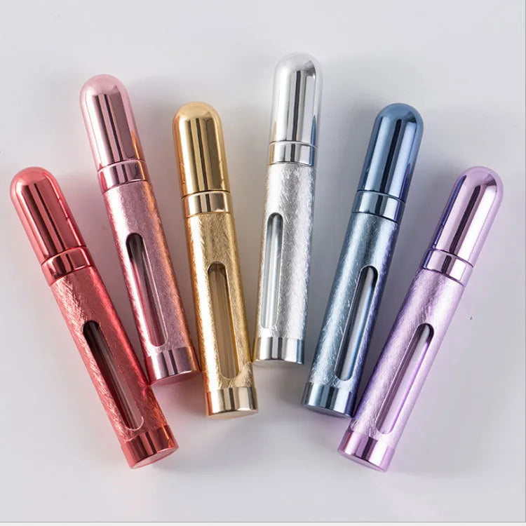 12ml aluminium portable perfume bottle atomiser in six colour options shown next to a ruler for scale.