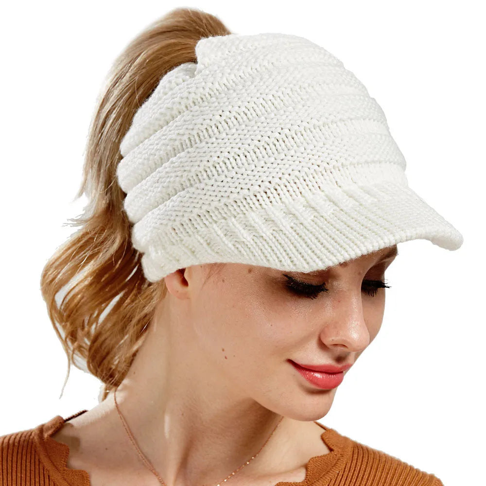 Women's thick knit ponytail beanie in acrylic yarn showing hairstyle accommodation